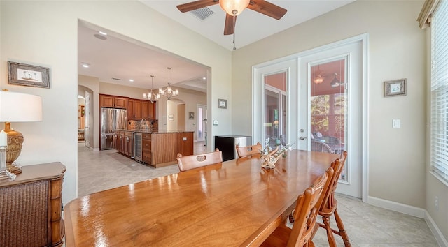 dining area with ceiling fan, plenty of natural light, beverage cooler, and french doors