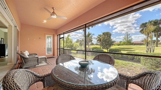 sunroom / solarium with ceiling fan