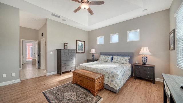 bedroom with ceiling fan and light hardwood / wood-style floors