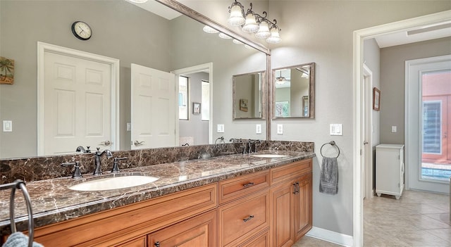 bathroom featuring vanity, tile patterned floors, and ceiling fan