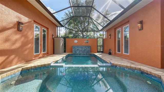 view of swimming pool with glass enclosure and an in ground hot tub