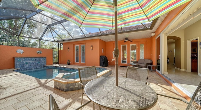 view of swimming pool featuring a jacuzzi, french doors, a patio, and glass enclosure