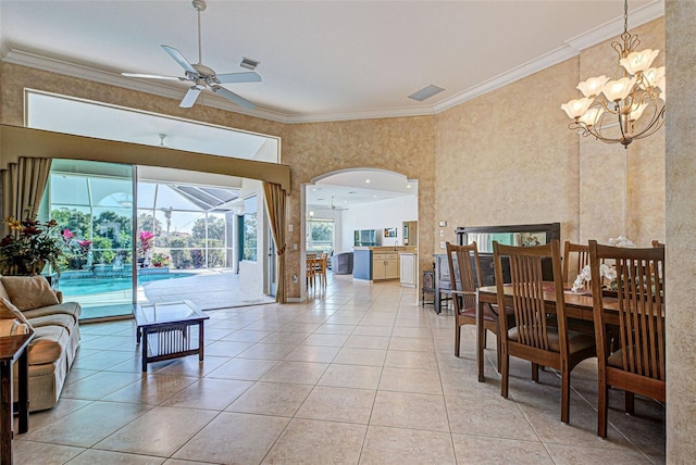 living room with crown molding, ceiling fan with notable chandelier, and light tile patterned floors