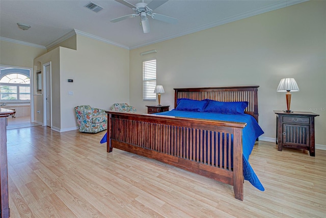 bedroom featuring ornamental molding, light wood-type flooring, and ceiling fan