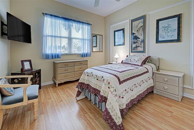 bedroom featuring ceiling fan and light hardwood / wood-style flooring