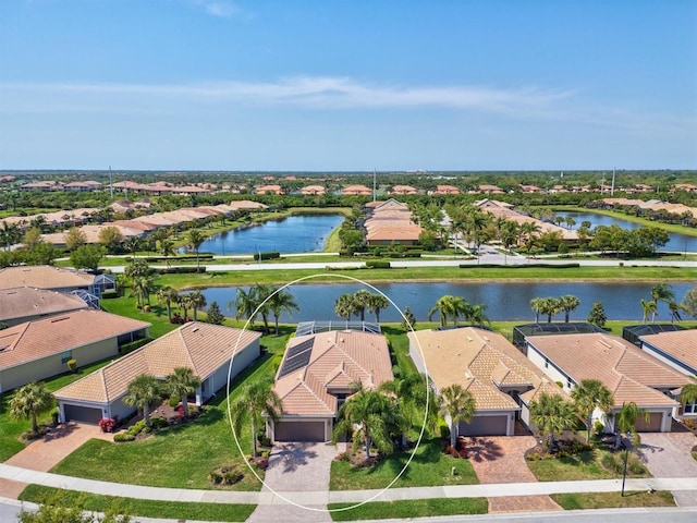 birds eye view of property featuring a water view