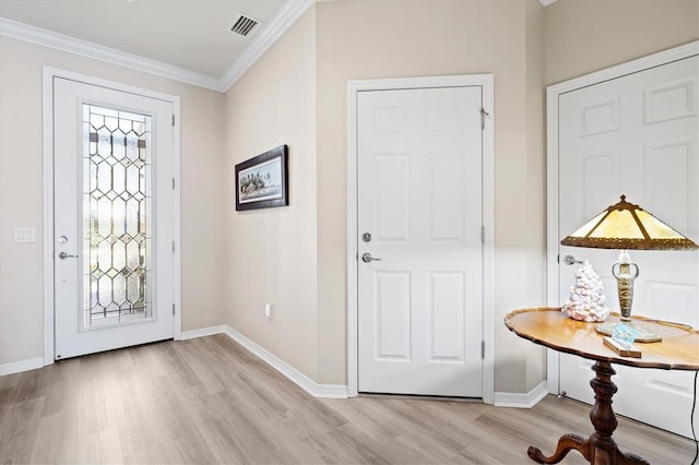 entrance foyer featuring light wood-type flooring and crown molding