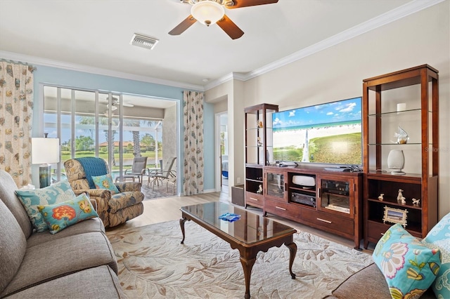 living room featuring light hardwood / wood-style flooring, plenty of natural light, crown molding, and ceiling fan