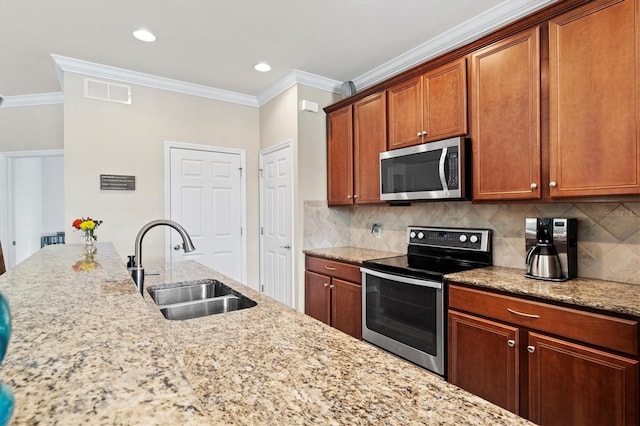 kitchen featuring sink, light stone counters, crown molding, decorative backsplash, and appliances with stainless steel finishes