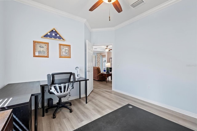 office with ornamental molding and light wood-type flooring