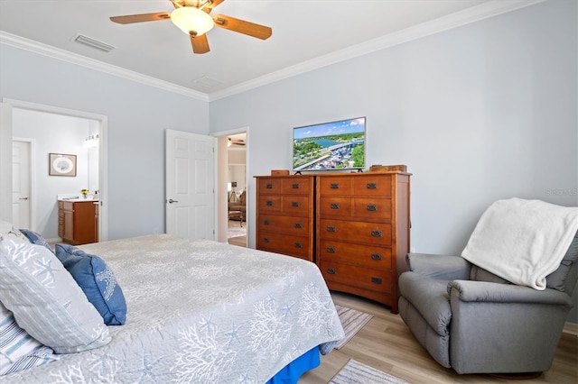 bedroom with connected bathroom, light hardwood / wood-style flooring, ceiling fan, and ornamental molding