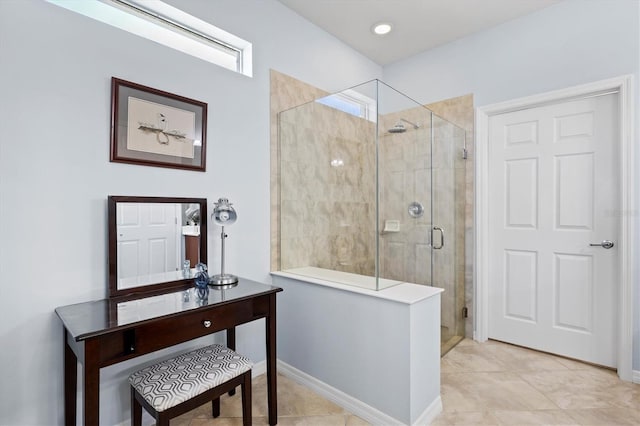 bathroom featuring tile patterned flooring and an enclosed shower