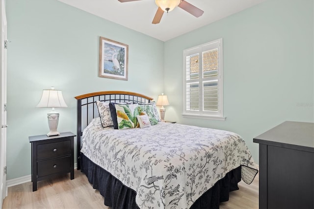 bedroom with light hardwood / wood-style flooring and ceiling fan