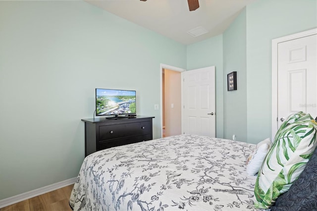 bedroom featuring hardwood / wood-style floors and ceiling fan