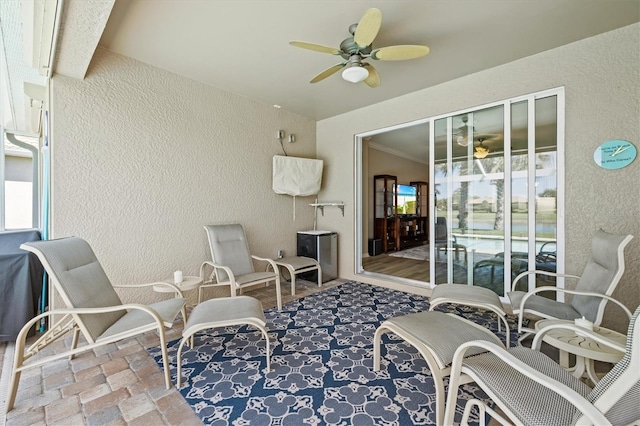 view of patio featuring ceiling fan