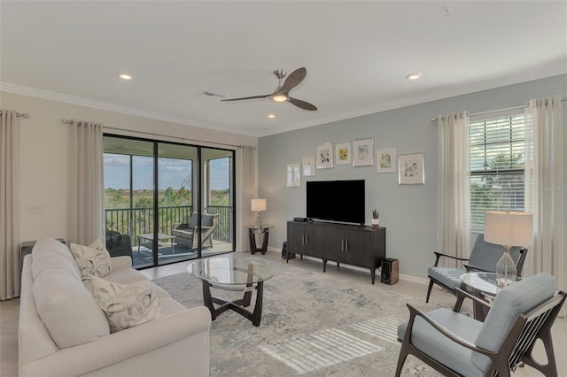 living room featuring ceiling fan and ornamental molding