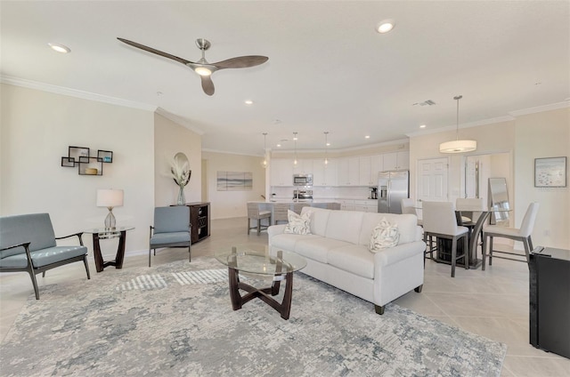 living room featuring ceiling fan, light tile patterned floors, and crown molding