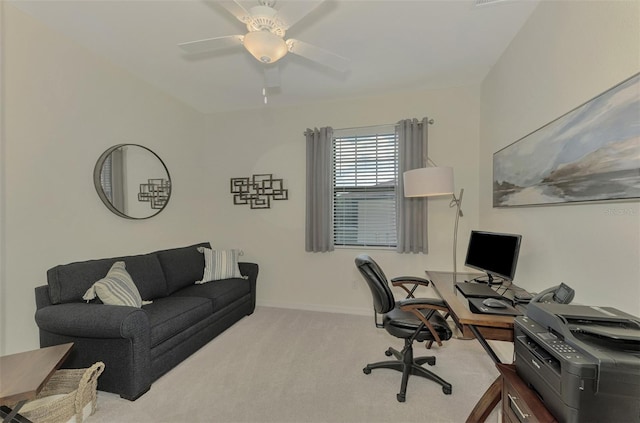 carpeted home office with ceiling fan