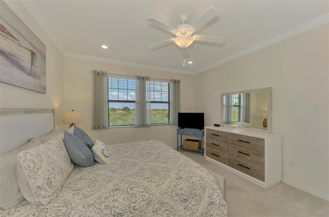 carpeted bedroom featuring multiple windows, ceiling fan, and crown molding