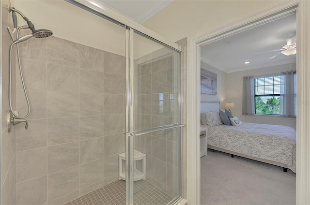 bathroom with ceiling fan, an enclosed shower, and ornamental molding