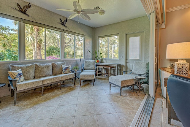 sunroom with ceiling fan and plenty of natural light