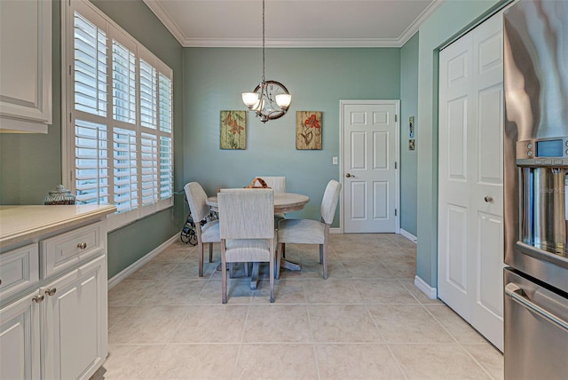 tiled dining space featuring an inviting chandelier and ornamental molding