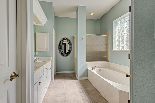 bathroom featuring tile patterned floors, vanity, and independent shower and bath