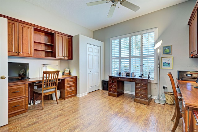 office area featuring light hardwood / wood-style floors and ceiling fan