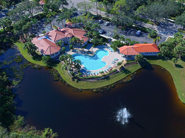 birds eye view of property with a water view