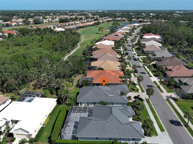 drone / aerial view featuring a residential view and view of golf course