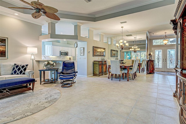 living room with visible vents, ornamental molding, french doors, light tile patterned flooring, and ceiling fan with notable chandelier