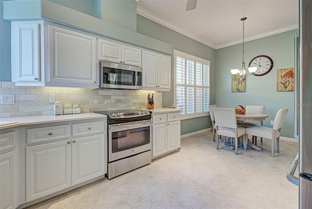 kitchen featuring light countertops, backsplash, ornamental molding, and stainless steel appliances