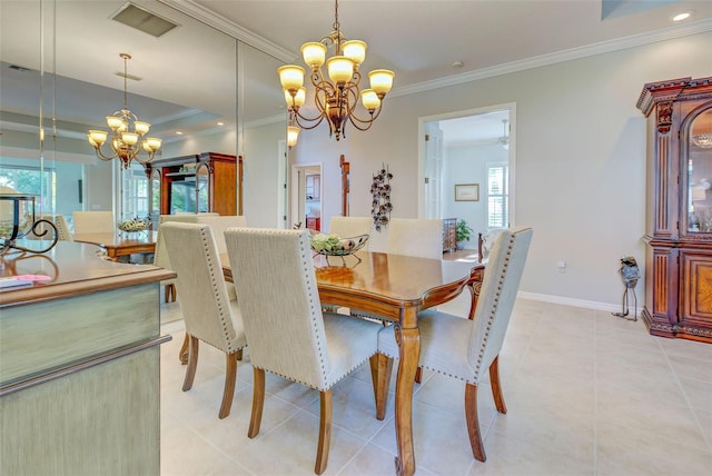 dining space featuring baseboards, a notable chandelier, crown molding, and visible vents