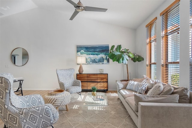 living room featuring ceiling fan and vaulted ceiling