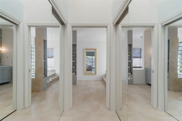 hallway featuring light tile patterned floors