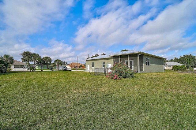 view of yard featuring a sunroom