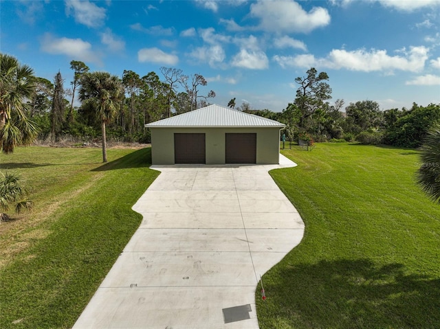 garage featuring a lawn