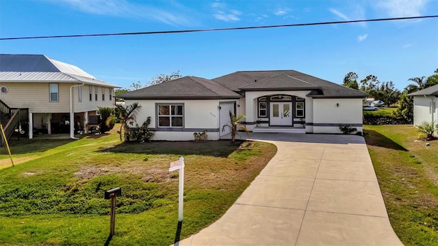 view of front of property with a front yard and a carport