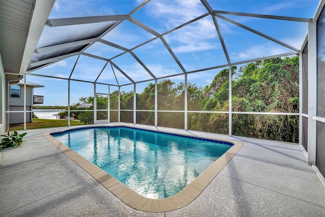 view of pool featuring a patio area and a lanai