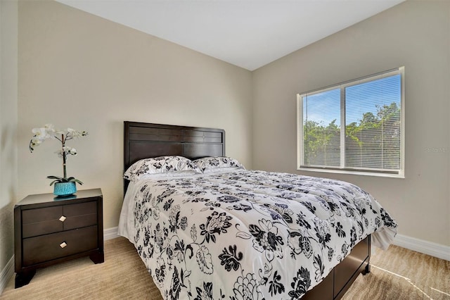 bedroom featuring light colored carpet