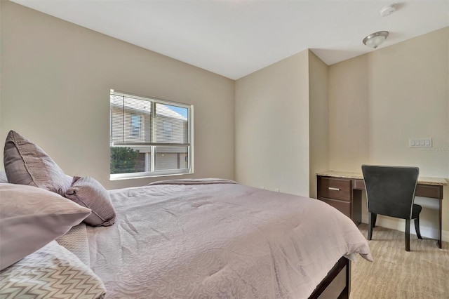 bedroom with light colored carpet