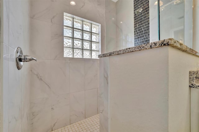 bathroom featuring tiled shower