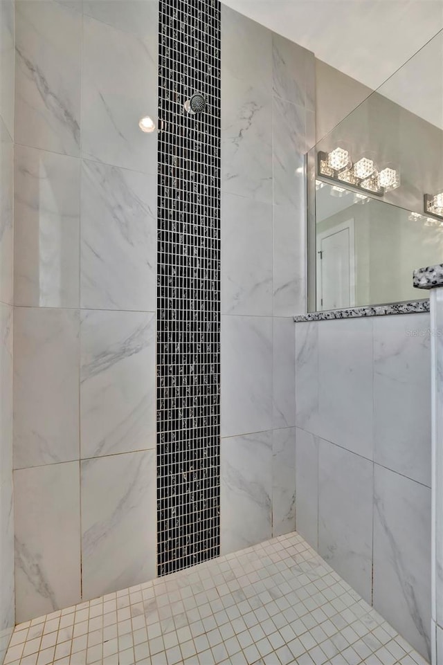 bathroom with tiled shower