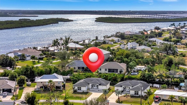 drone / aerial view featuring a water view