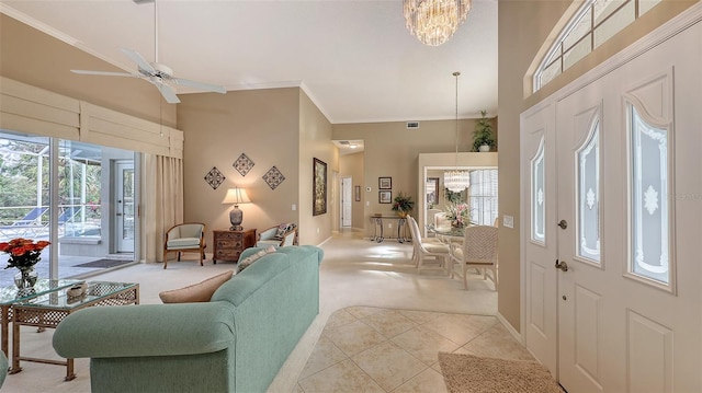 275 Royal Oak Way, Venice, FL 34292 - living room with a towering ceiling, a chandelier, light carpet, ornamental molding, and a ceiling fan
