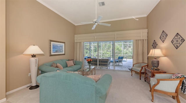 living room featuring light carpet, ceiling fan, and ornamental molding