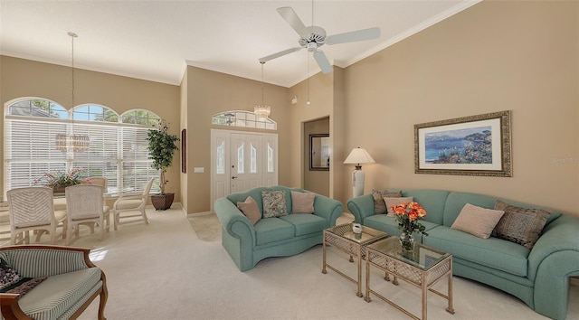 275 Royal Oak Way, Venice, FL 34292 - carpeted living area with ornamental molding, a high ceiling, and a ceiling fan
