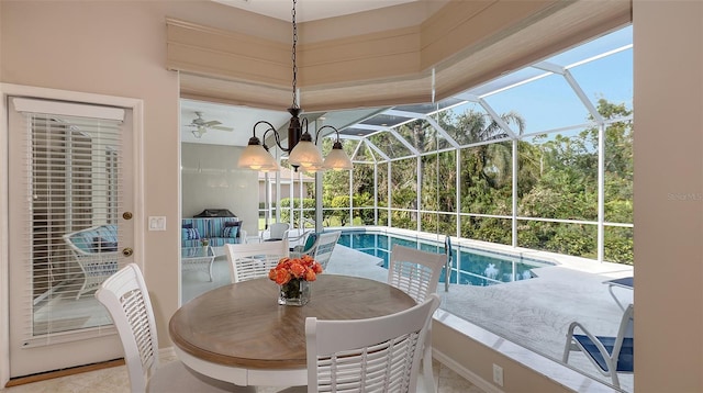 view of swimming pool featuring glass enclosure and a patio area