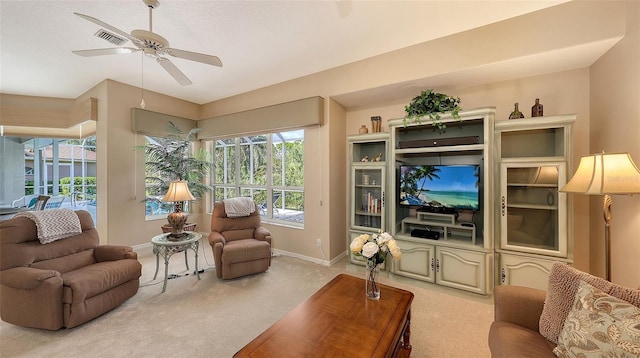 275 Royal Oak Way, Venice, FL 34292 - carpeted living room featuring baseboards and a ceiling fan