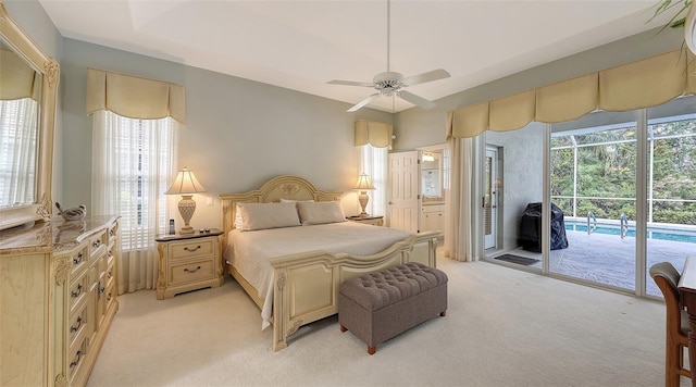 275 Royal Oak Way, Venice, FL 34292 - bedroom with access to exterior, light colored carpet, and a ceiling fan
